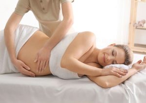 The lady enjoying prenatal massage with the out call spa in Singapore
